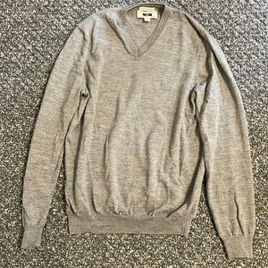 Small whole on left arm